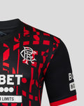 Front chest view of Rangers FC 2026/27 third shirt with crest and bold red geometric pattern on black fabric