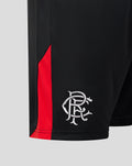 Close-up of the woven Rangers scroll crest on the right leg of black shorts with a red side panel.