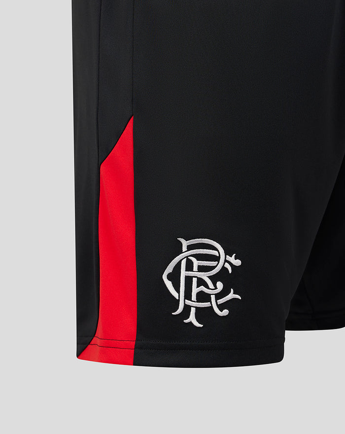 Close-up of the woven Rangers scroll crest on the right leg of black shorts with a red side panel.
