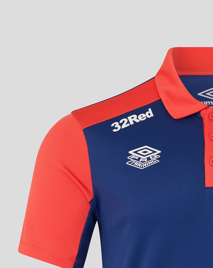 Close-up of twilight blue Rangers FC pro training polo showing coral shoulder panel and sponsor logos on the chest.