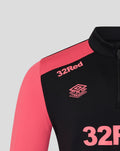 Shoulder close up of Rangers training top showing coral pink sleeve and 32Red logo on black fabric