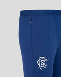 Twilight blue Rangers FC training pants close up showing back zip pocket and white club crest on the thigh