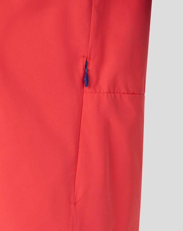 Red jacket side panel with blue zipper pocket detail
