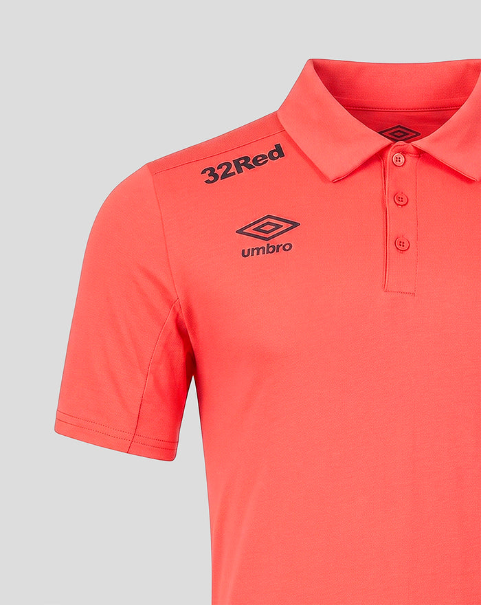 Close up of coral polo shoulder showing 32Red text and Umbro logo