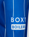 Close-up of royal blue Rangers home shirt fabric with white piping and a BOX BOILERS sponsor patch
