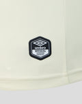 Close up of off white fabric featuring an Umbro official licensed product patch.