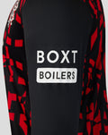 Close-up of Rangers mens third long sleeve shirt showing black fabric with red geometric pattern and partial Umbro logo