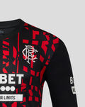 Close up of the Rangers jersey chest showing the Umbro logo and bold red graphic motif.