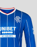 Close-up of blue Rangers home pro long sleeve jersey showing crest on chest and UNIBET sponsor and red and white trimmed collar.