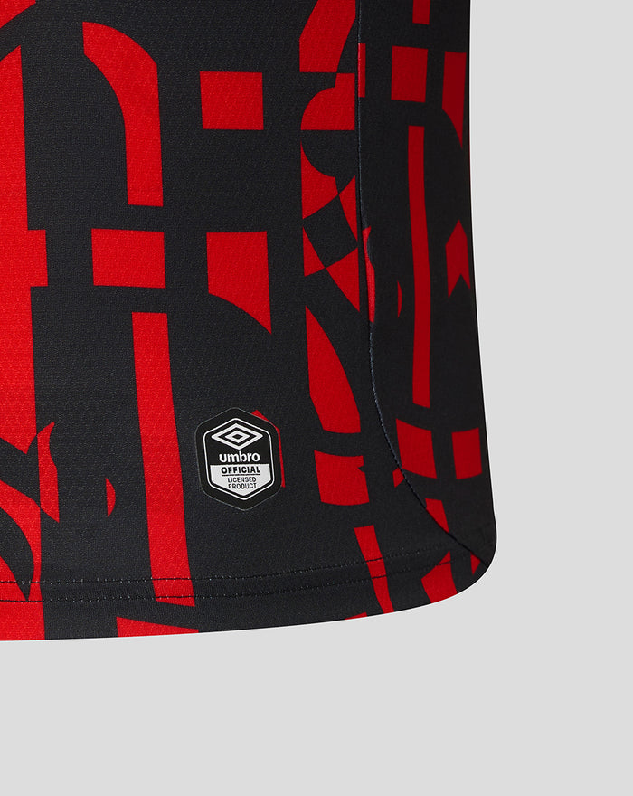 Close up of Rangers third shirt sleeve with red graphic pattern and Umbro official badge.