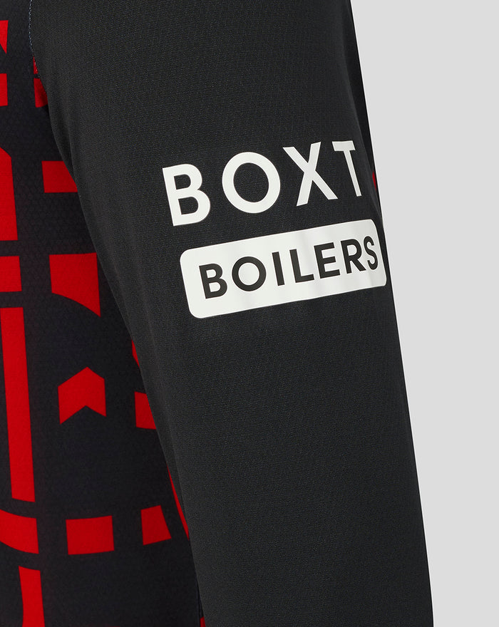 Close up of Rangers third shirt sleeve with BOXT BOILERS sponsor on black fabric and red graphic pattern.