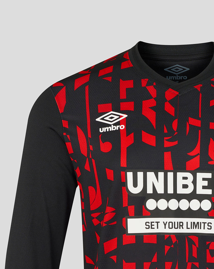 Close up of Rangers third pro long sleeve shirt displaying red geometric pattern, Umbro logo on the chest and UNIBET sponsor across the front.