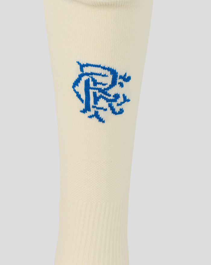 Rangers FC junior away sock close up showing crest on cream fabric and blue cuff edge