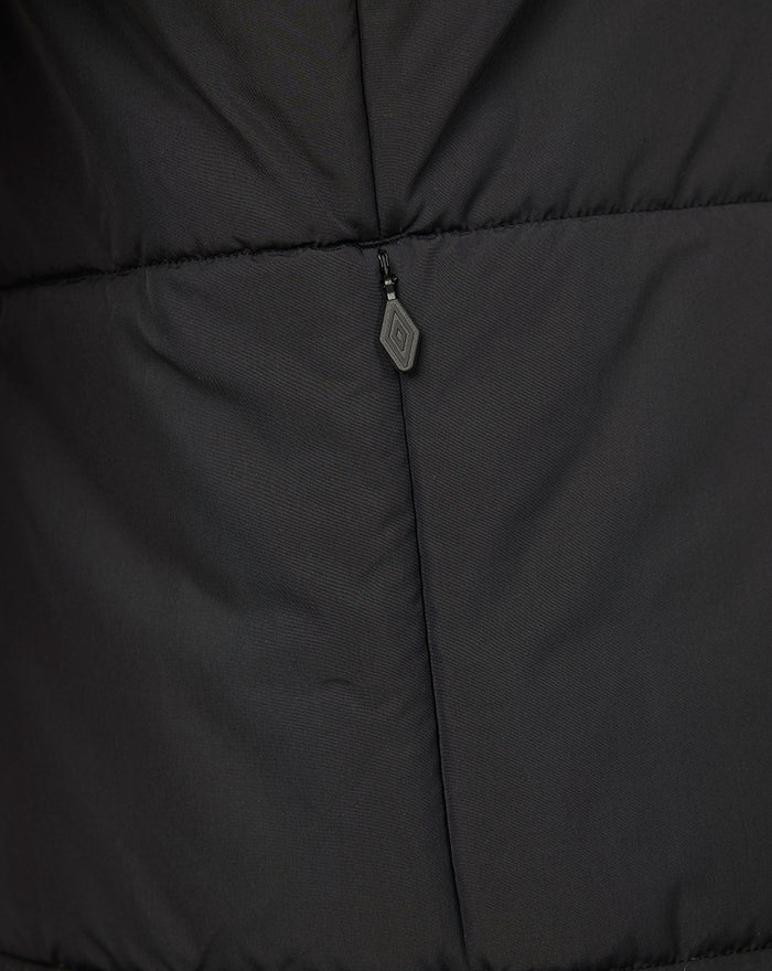 Close up of the zipper on a dark Rangers FC training gilet showing quilted fabric.