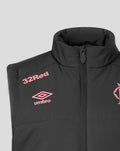 Close-up of navy training gilet collar area showing coral 32Red and Umbro logos and the zipper.