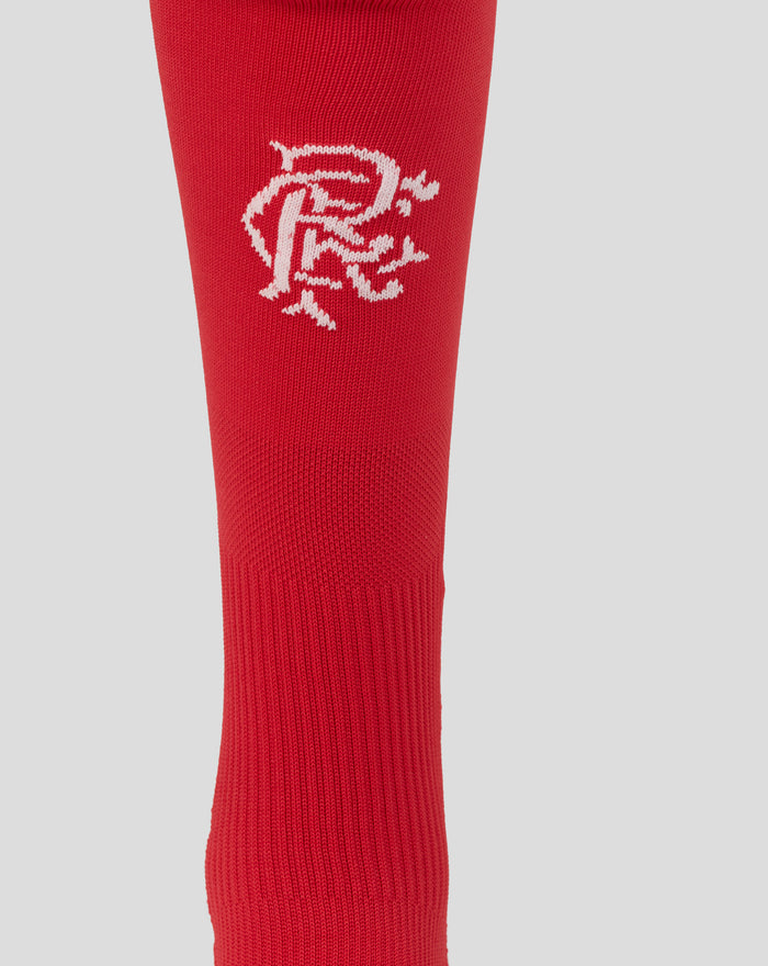 Close-up of red socks showing white knitted Rangers club text on the fabric.