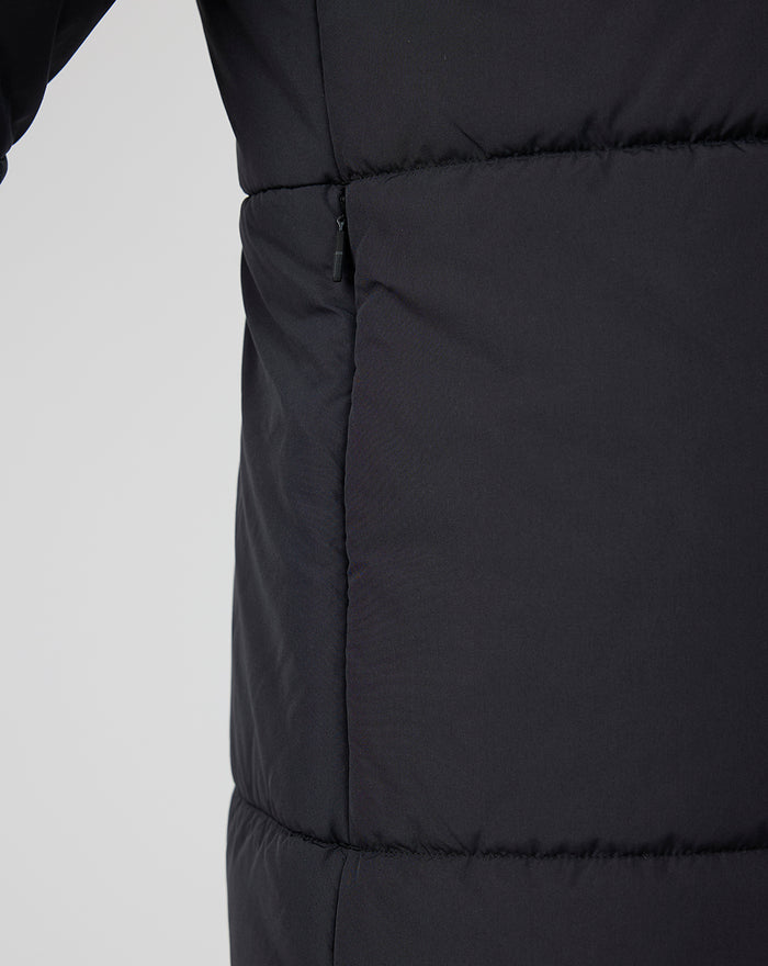 Close up of side seam with zipper pocket on navy padded Rangers FC training jacket