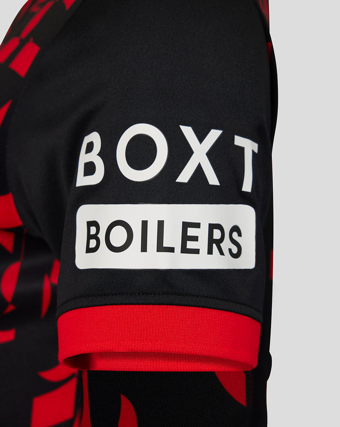 Close-up of sleeve on Rangers womens 2026/27 third shirt showing black fabric with red geometric pattern and a white sponsor patch