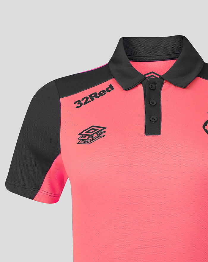 Shoulder close up showing coral body and black sleeve color blocking on the Rangers FC training polo.