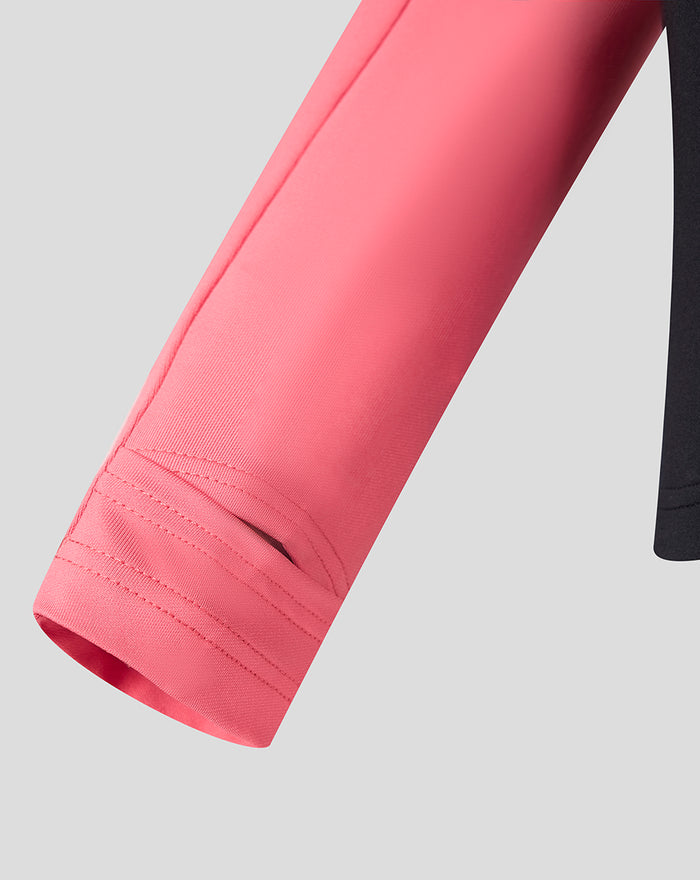 Close up of coral pink sleeve on a Rangers FC training top.