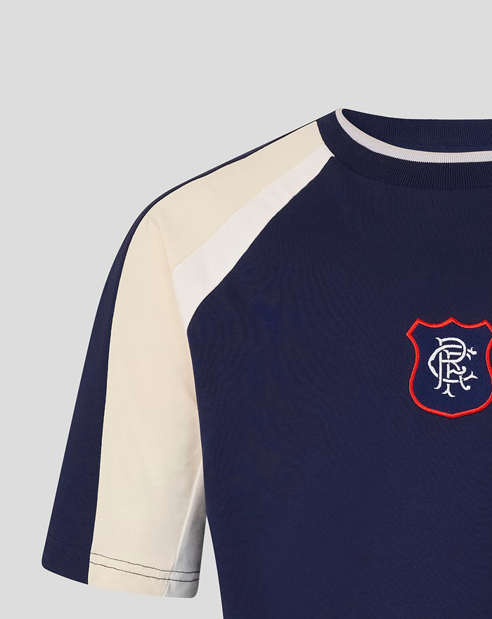 Close up of navy panelled tee showing contrasting cream shoulder panel and light sleeve panel.