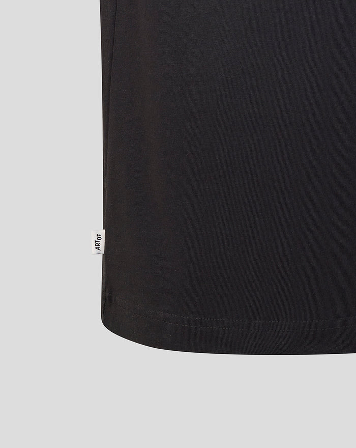 Hem view of the black T shirt with a small white Art Of tag.