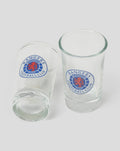 Two clear shot glasses with the Rangers Football Club crest on the front.