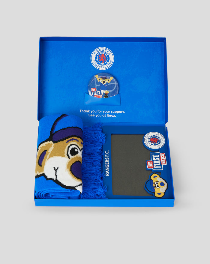 Blue gift box interior featuring a Rangers FC crest and a round My First Match badge in a blue envelope