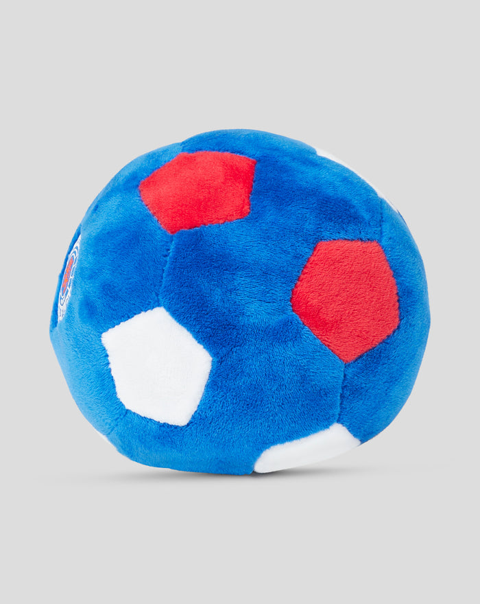 Close-up of the blue plush football showing red patches and white panels