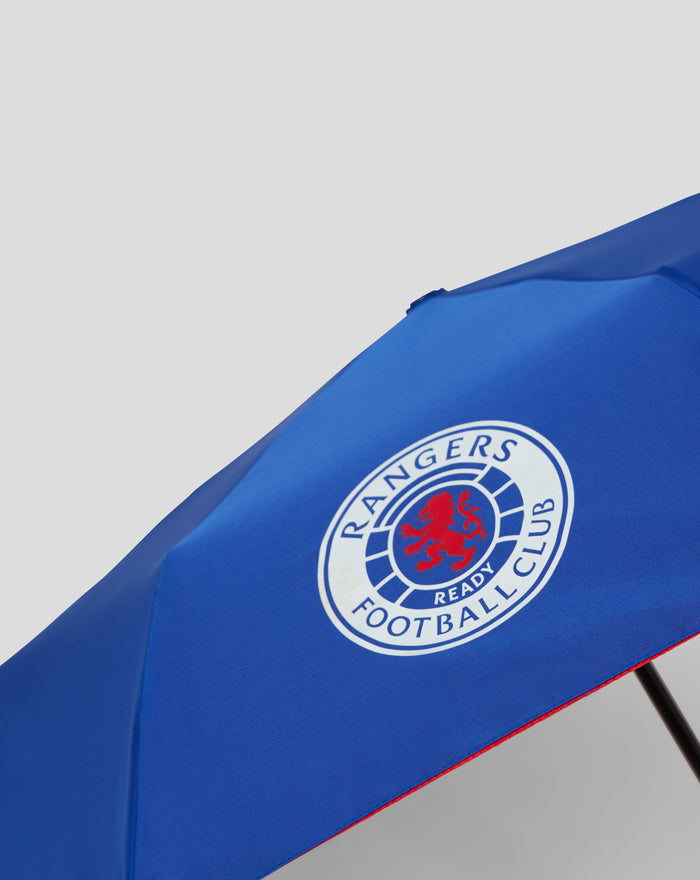 Blue folded telescopic umbrella with black wrist strap and cylindrical handle