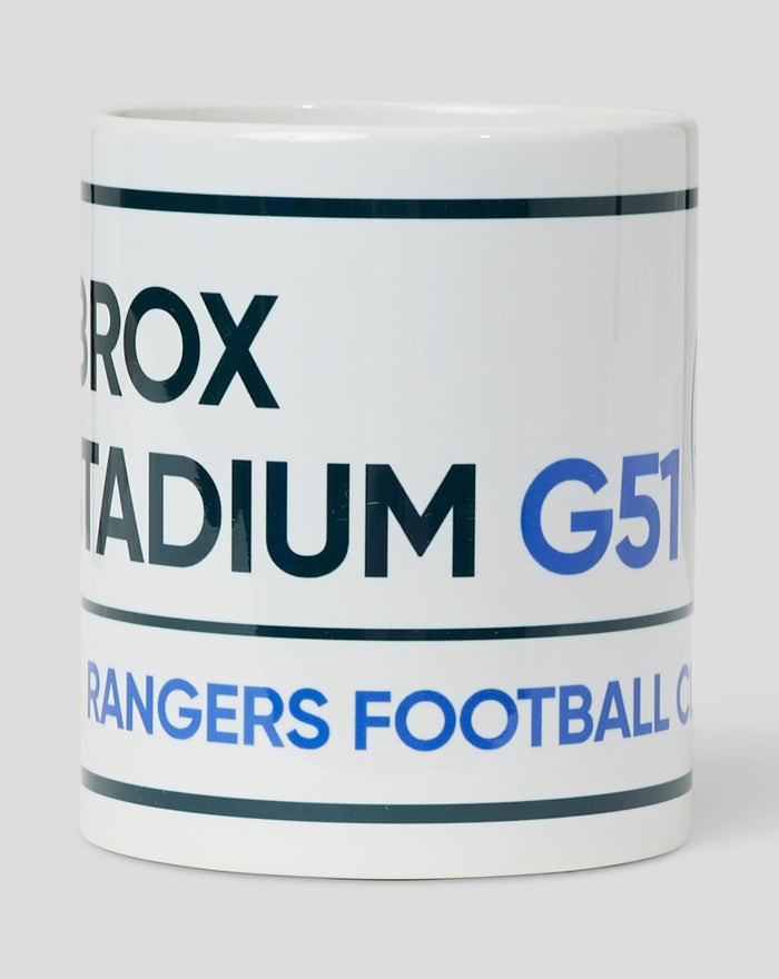 Road Sign mug close-up; white ceramic with a dark blue horizontal stripe.