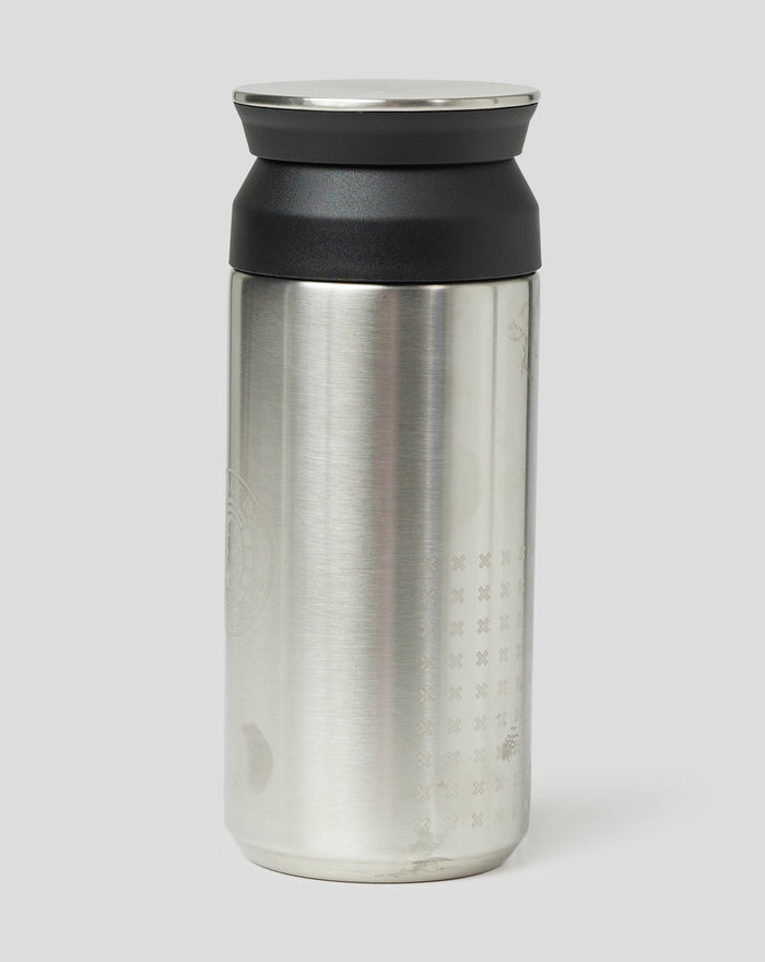 Close up of a Rangers travel tumbler showing brushed stainless body with an engraved pattern and black lid