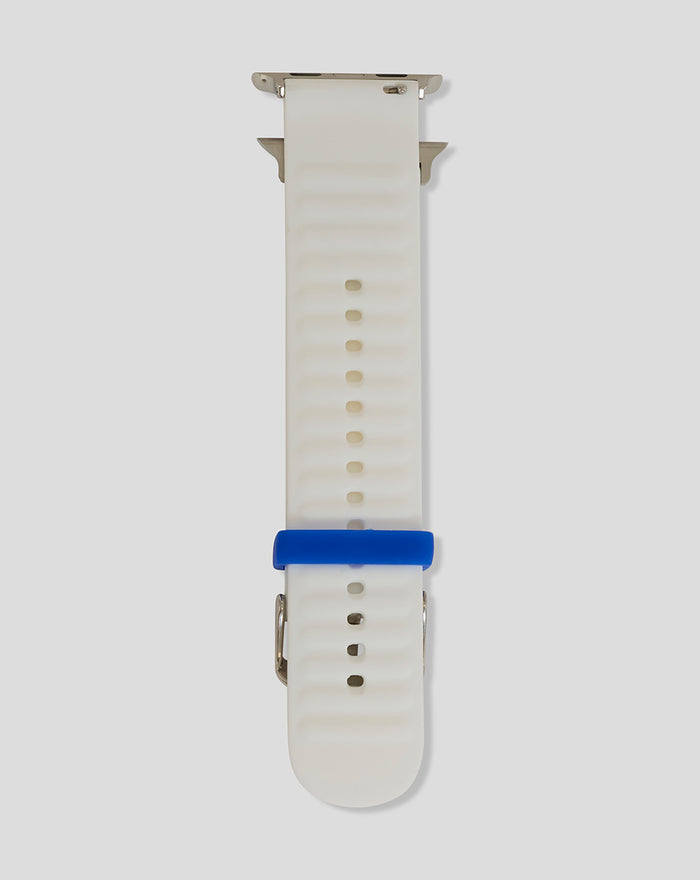 Back view of white silicone watch strap showing adjustment holes and blue Rangers keeper loop