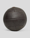 Rear view of a dark brown deluxe leather football showing stitched panel construction.