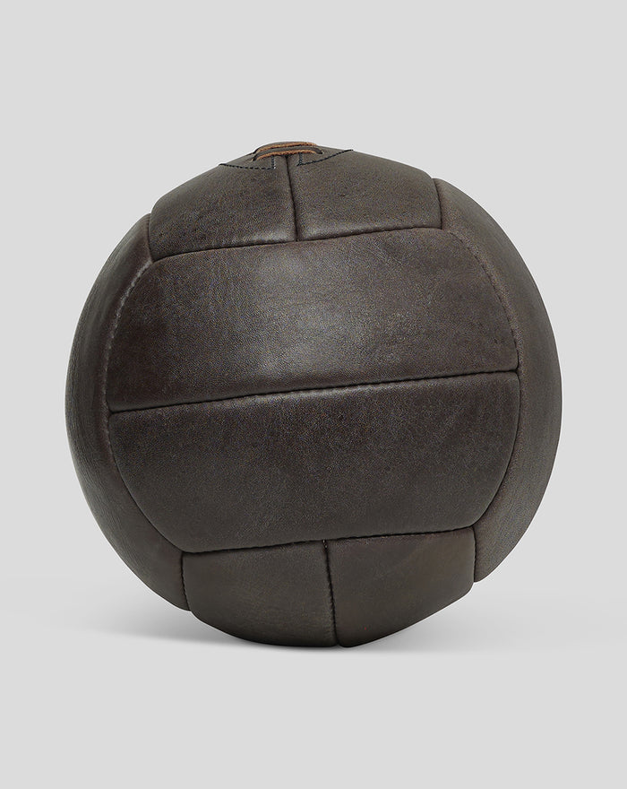 Rear view of a dark brown deluxe leather football showing stitched panel construction.