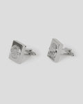 Pair of polished silver cufflinks with square faces and embossed crest detail