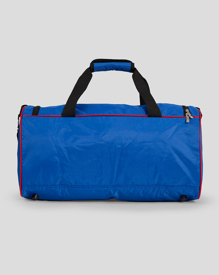 Back view of blue Rangers 24/25 holdall with black carry handles and red piping along the top edge.