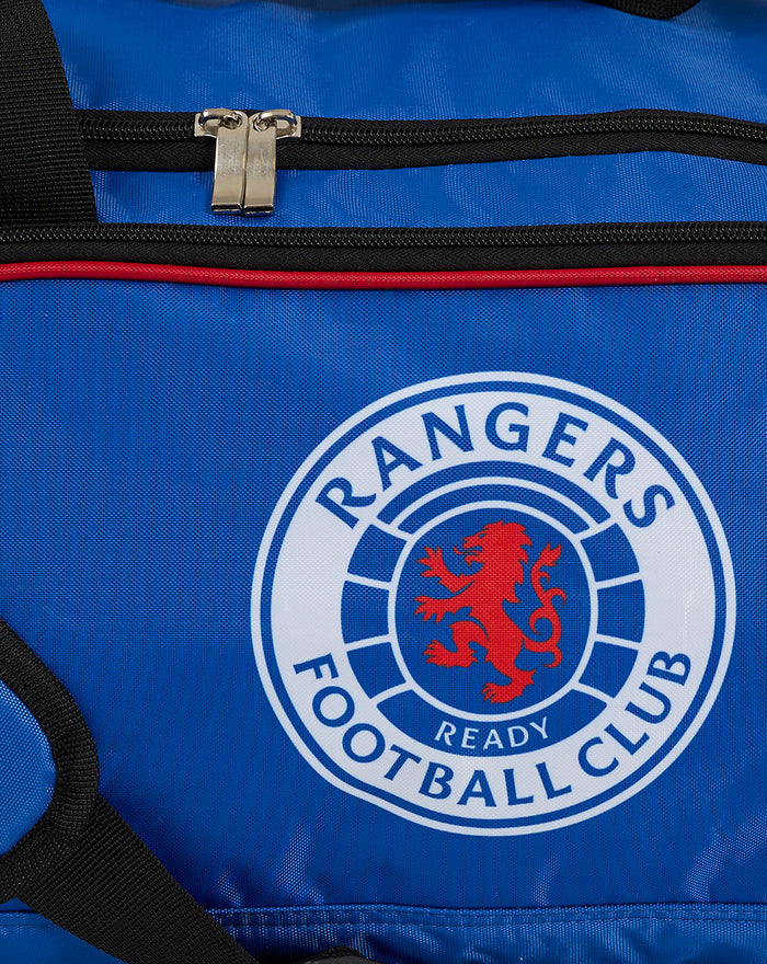 Close up of Rangers crest on blue holdall with top zipper visible.