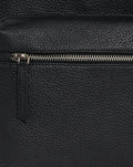 Close up of a metallic zipper on black pebbled leather Rangers Premium Leather Backpack