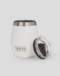 Close up of white YETI 10oz tumbler with stainless rim and nearby lid