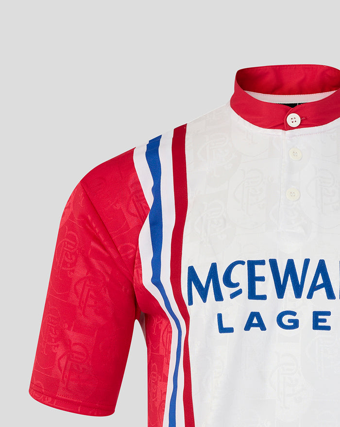 Rangers away shirt shoulder close-up showing red sleeve, red collar, and crest on white fabric with blue stripe accents.