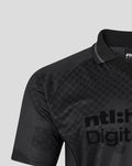 Close-up of the black blackout shirt showing a dotted pattern and large digital style lettering on the chest