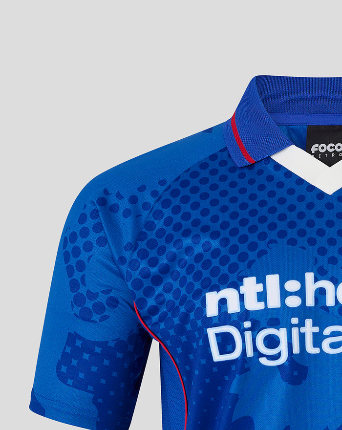 Close up of blue retro 2002-03 home shirt showing dotted pattern collar and red piping