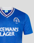 Close-up of the collar with white navy geometric trim and Rangers crest on a blue 1991-92 home shirt
