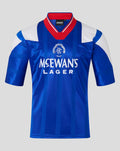 Front view of a blue retro 1992-94 home shirt featuring vertical stripes crest and Meewan's Lager sponsor.