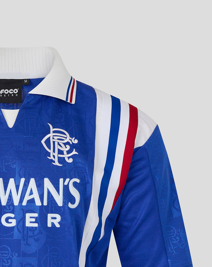 Shoulder and chest of the blue retro 1996-97 home shirt with stripe detailing and crest on the left