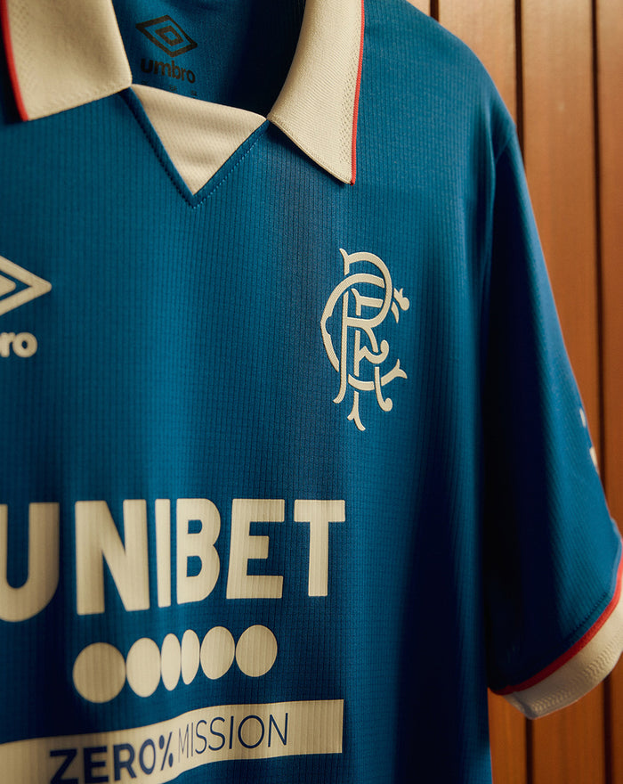 Rangers FC 25/26 home shirt close up blue fabric with Umbro logo on the chest club crest and UNIBET sponsor
