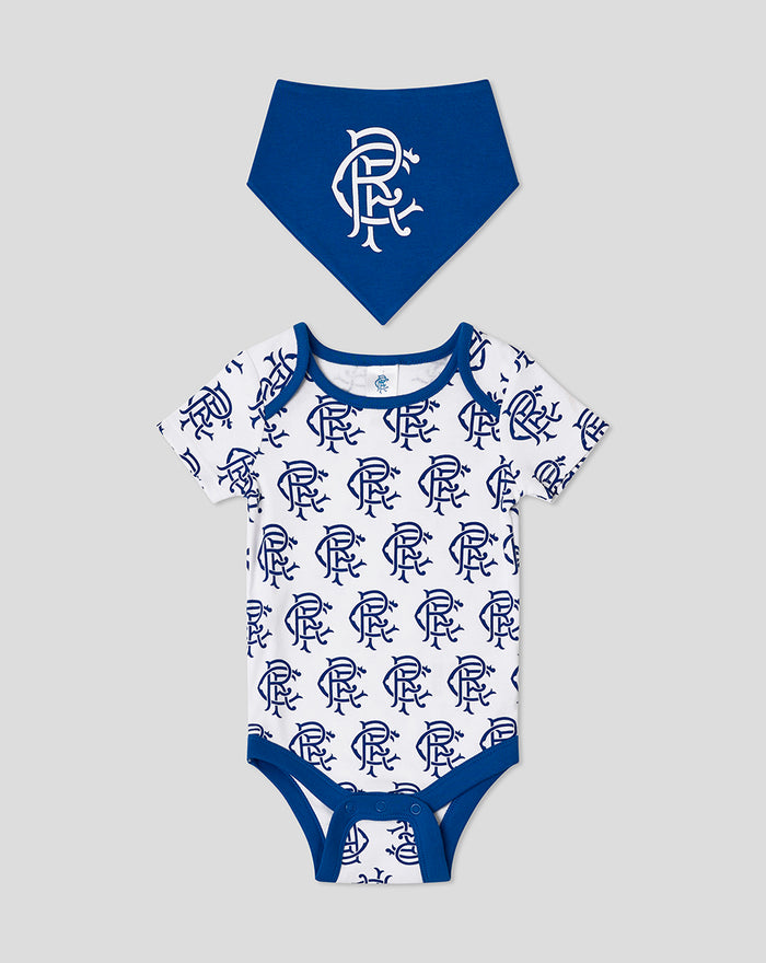 White baby onesie with blue crest pattern and a solid blue bandana bib