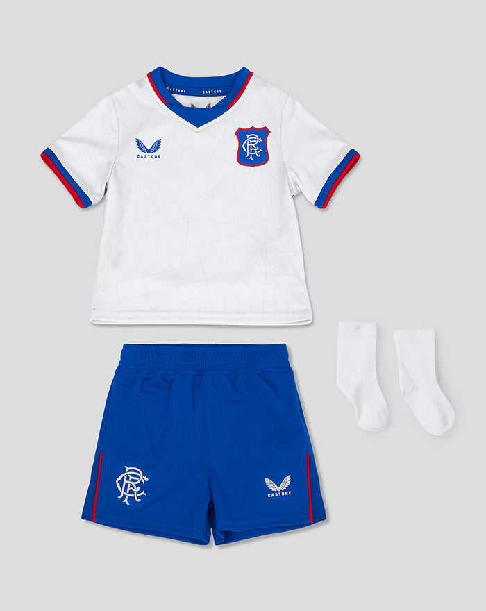Baby Rangers Away Nested kit laid out with white short sleeve jersey blue shorts and white socks crest and Castore logos visible.