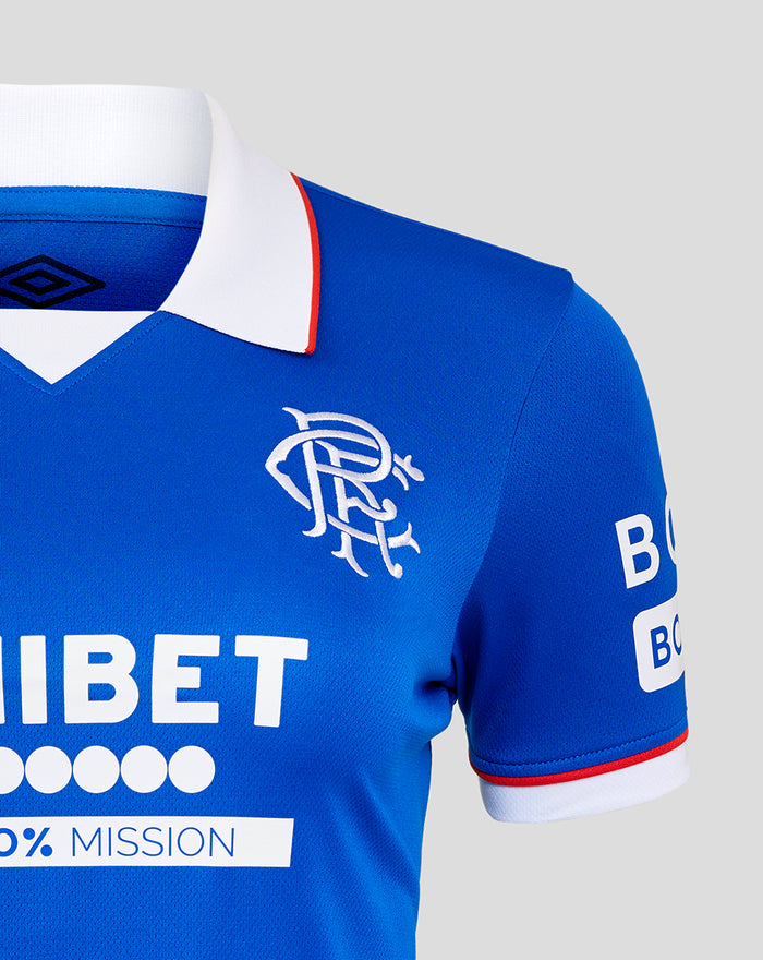 Close-up of Rangers 25/26 Home shirt collar and chest on blue fabric with white collar and red trim Umbro logo and crest.